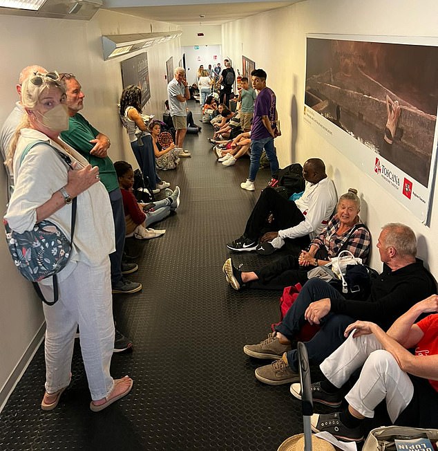 Hundreds of Brits are LOCKED in sweltering Italian airport corridor for an HOUR with no water