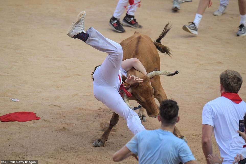 Bulls charge through the streets of Pamplona for first time in three years with five hospitalised