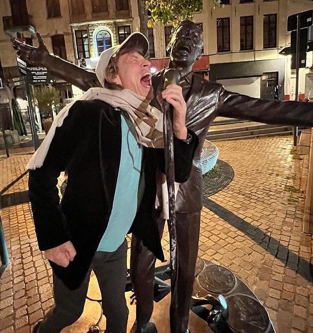 Mick Jagger, 78, larks about in playful snaps as he explores Brussels ahead of Rolling Stones’ gig