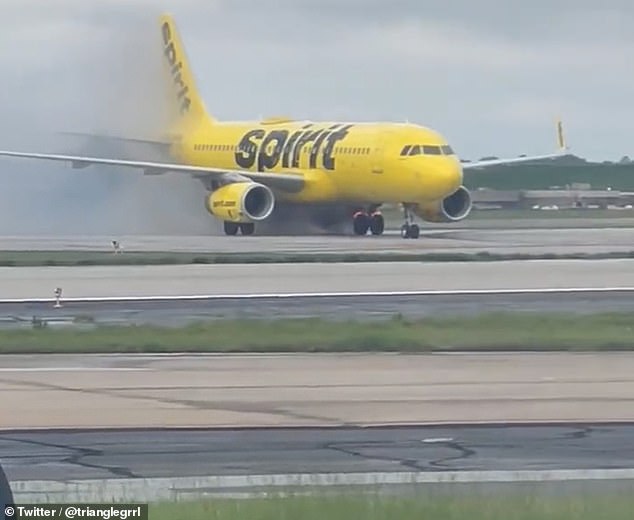 Terrifying moment Spirit Airlines plane erupts in flames on landing in Atlanta as brakes overheat