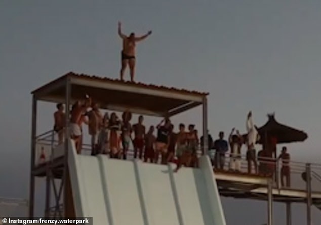 Moment daredevil leaps onto a slide and is catapulted 30ft into the air before slamming face