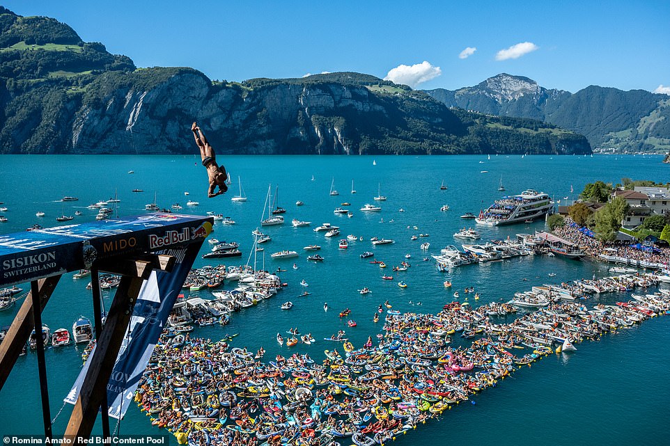 Images show daredevil divers leaping from an 88ft platform for a Swiss cliff-diving contest