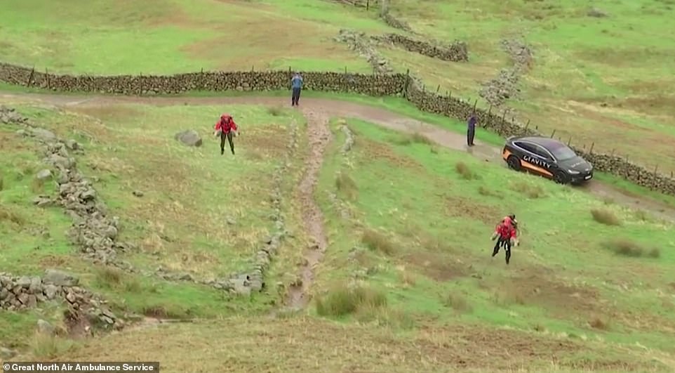 Paramedic flies up a hill in the Lake District wearing a jet pack in emergency response trial