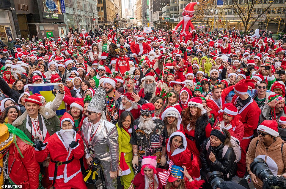 Thousands of St Nick fans flock to NYC for SantaCon as NYPD braces itself drunken crowdgoers