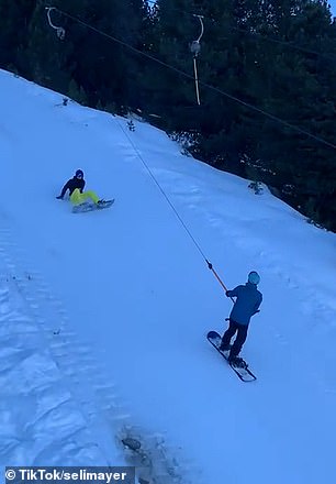 Snowboarder loses grip of tow lift and wipes out skiers, leaving four of them in hospital