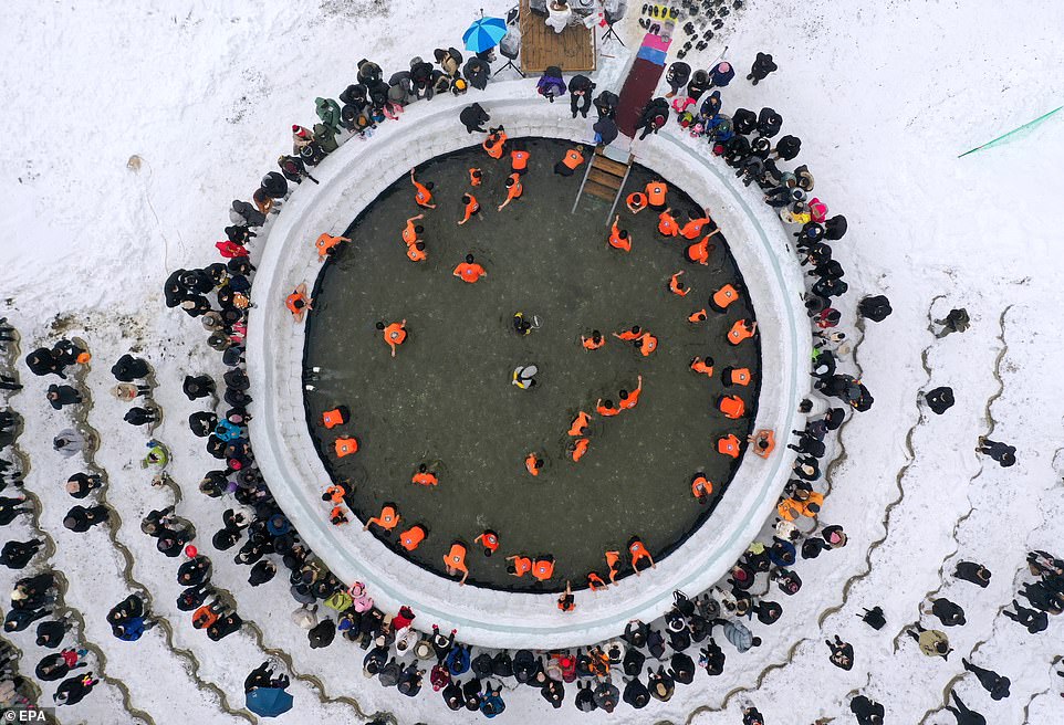Visitors from around the world descend on South Korean ice fishing festival to catch trout