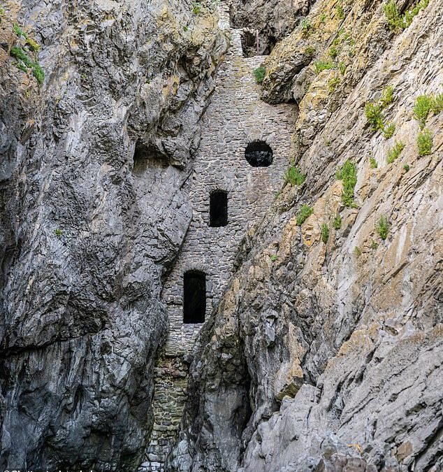 Pictured: Culver Hole, the spooky secret smugglers’ cave in Wales that’s sealed in by a stone wall