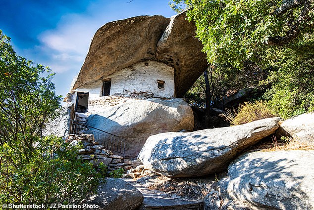 Pictured: The houses hidden under giant boulders on the stunning Greek isle of Ikaria