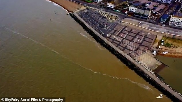 Dirty brown waters lap the coast of popular Kent seaside hotspot in shocking drone footage