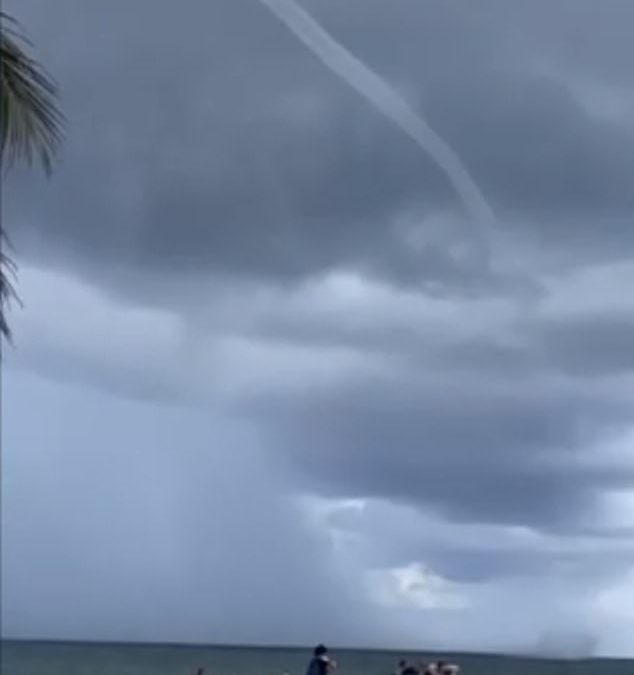 Florida beachgoers flee as huge waterspout spins onshore