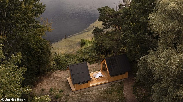 Pictured: The incredible £380,000 wooden cabin that slides open so you can sleep under the stars