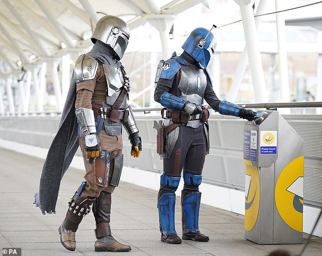 The DLR strikes back! Star Wars fans dressed as the film’s heroes and villains battle with the Tube