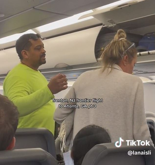 Disruptive female passenger is kicked off Frontier flight after passengers VOTE to get rid of her 