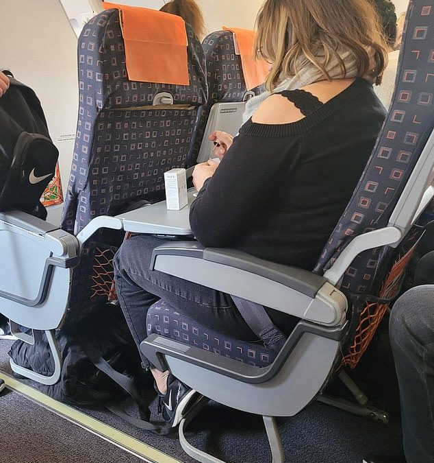 Traveller causes outrage for painting her nails on a flight as hundreds slam the act as selfish