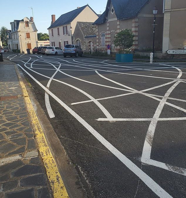 Forget speed bumps! The French village where SQUIGGLY LINES have been painted on roads to stop drivers from speeding (and it’s working… but also making them feel sick)