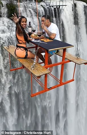 Pie in the sky! Eye-popping video shows ‘brave’ couple dining on a picnic table that’s suspended 295ft over a thundering waterfall