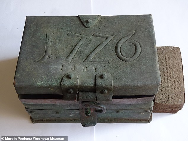 ‘World’s oldest time capsule’ – dating back to 1726 – is found in Polish church spire, containing 300-year-old coins, Latin documents and a lead bullet