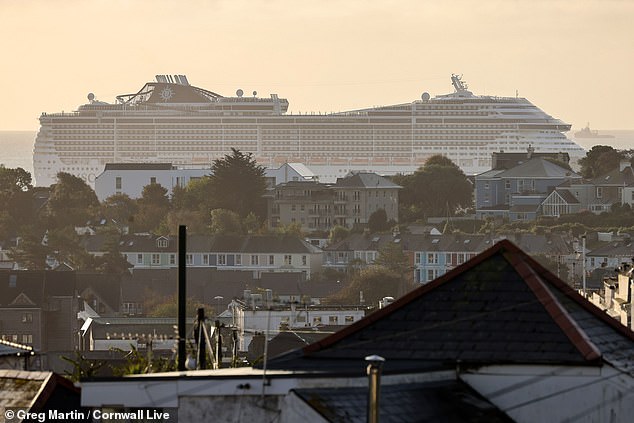 Massive cruise ship MSC Preziosa towers over Falmouth as it weighs anchor outside Cornish town on final stop of 11-day trip