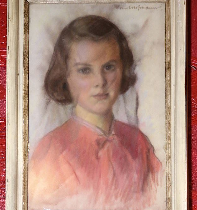 My close encounter with the ‘haunted’ portrait of the girl with a creepy gaze: Painting that proved too scary to own is now on the wall at London attraction – do YOU dare go and see it?