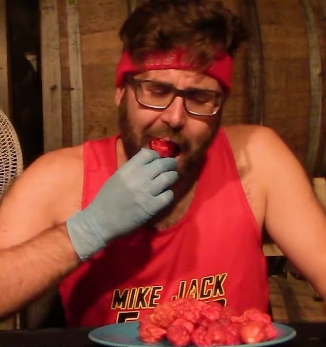 Speed eater who ate 50 of the world’s hottest peppers in record time (then devoured another 85) says he was inspired by famous Buddhist monk who BURNED himself to death