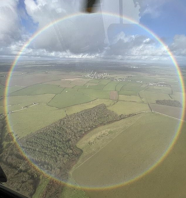 Police helicopter captures a stunning photo of a rare FULL CIRCLE rainbow over the Vale of Glamorgan
