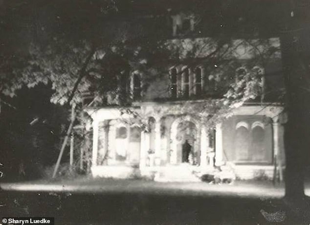 Spectre-cular photos! Ghostly figures ‘caught on camera’ lurking in windows and doorways of a 19th-century mansion in Alton… America’s ‘most haunted small town’