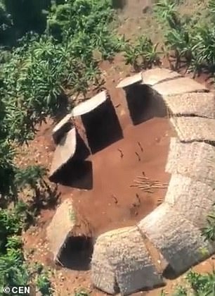 Thugs fly a helicopter over ‘uncontacted’ Brazilian tribe and shout insults at them – before indigenous warriors fire ARROWS at them