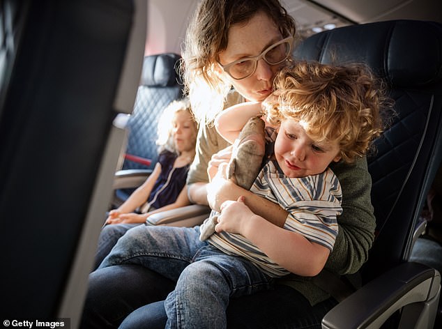 Man sparks debate after revealing he was YELLED at by a mother on a flight for watching an R-rated movie on his phone that made her son cry – so whose side are YOU on?