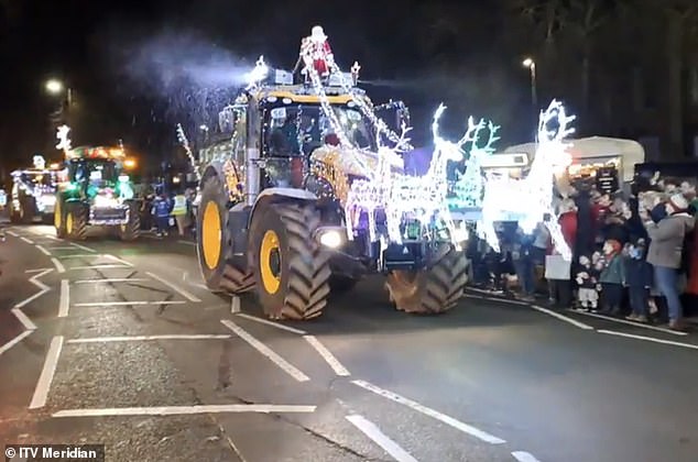 Over 100 colourful tractors covered in Christmas lights delight locals in annual Banbury festive fundraiser