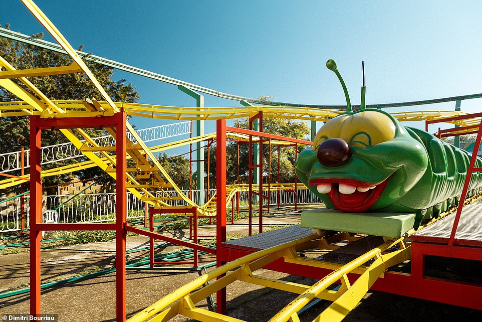 A silenced merry-go-round and dusty dodgems: Haunting images show an eerie abandoned funfair in Cyprus