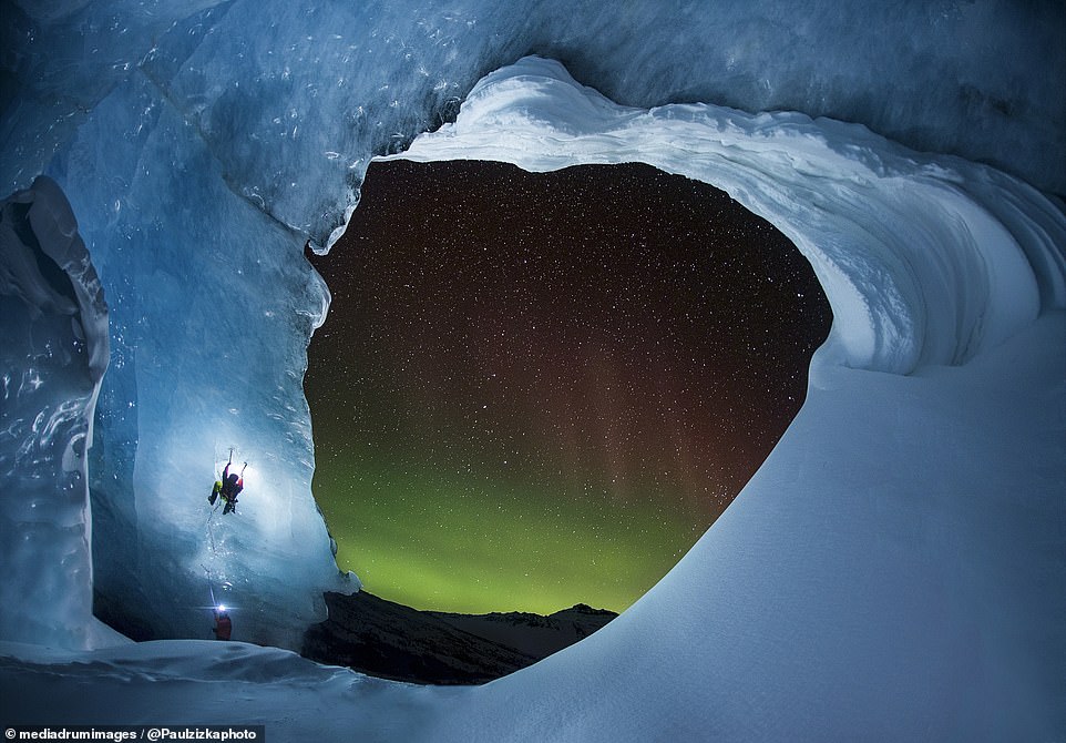 Mesmerizing images capture daredevil climbers hanging from ice caves and rock faces against a stunning backdrop of the Northern Lights