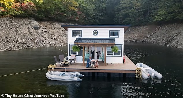 Couple reveal how they built a floating tiny house for $90k so they can live off grid on a North Carolina lake with their dog – who needs rowing to shore to go to the toilet