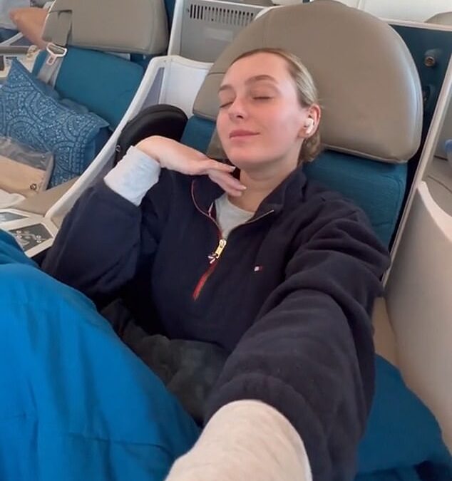 Mother sparks fierce debate after admitting she left her 10-month-old baby and her boyfriend in ECONOMY while she flew business class on an 11-hour flight