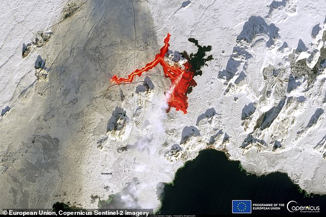 See Iceland’s volcanic eruption from SPACE: Dramatic photo snapped by a satellite shows lava seeping into the frozen landscape