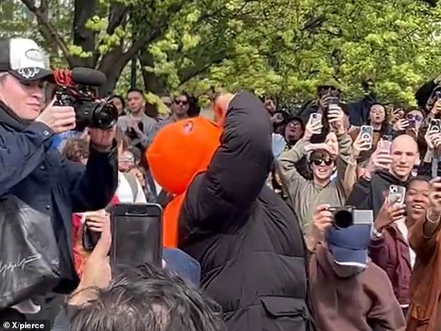 Bizarre moment NYC crowd chants and cheers on man who ate 300 cheese balls in record-breaking time