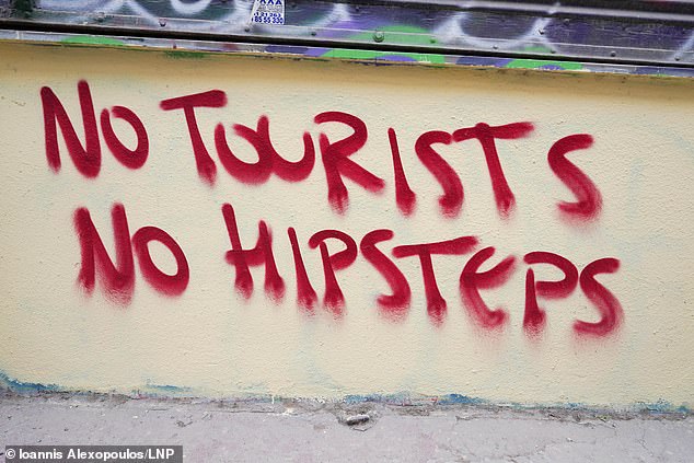 ‘No tourists, no hipsters’: Anti-tourism graffiti spreads across Athens as Greek capital joins other European destinations in demanding an end to ‘over-tourism’