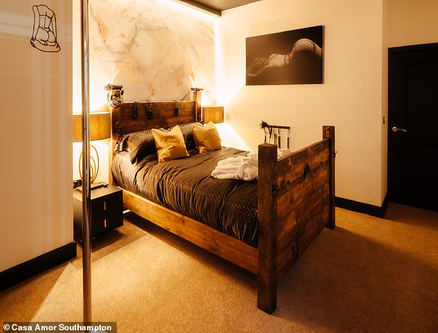 Inside sex-themed Airbnb with soundproof mirrored walls, an intimacy swing, hot tub and BONDAGE room (with handcuffs and cross)