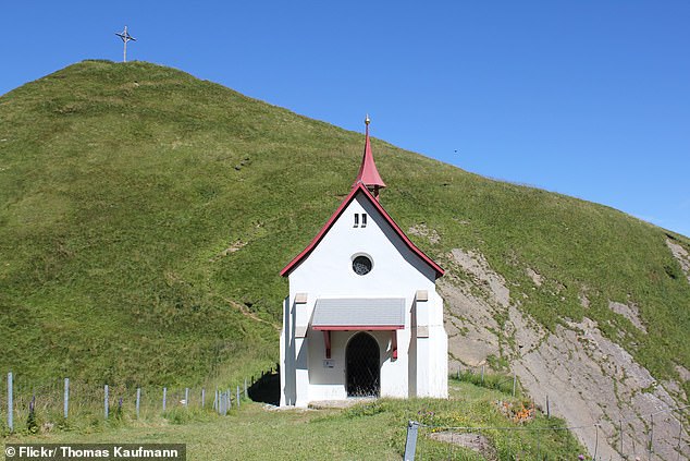 Pictured: The incredible neo-Gothic chapel that sits over 6,000ft up on the edge of a mountain in Switzerland