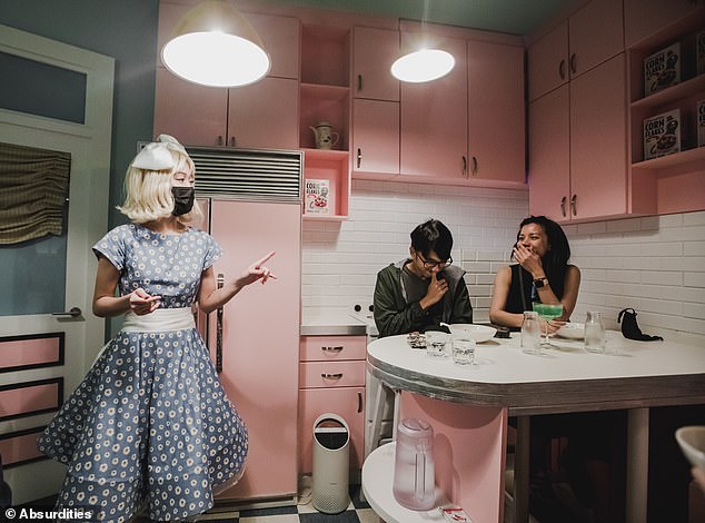 The most bizarre dining experience in the world? This restaurant in Singapore makes guests CRAWL through a hole for their food… and waitstaff wear zebra costumes