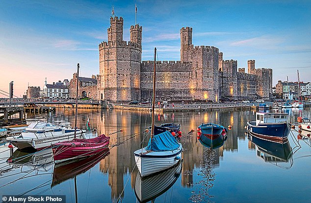 Britain at its best: Inside the royal town of Caernarfon – home to a medieval masterpiece of a castle where a teenage Charles was invested as the Prince of Wales