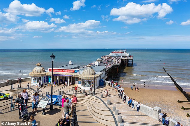 Britain’s new Caribbean coast: Visitors to town are dazzled by the resort’s new ‘tropical’ sea after chalk kicked up by coastal defence scheme transforms waters azure-blue