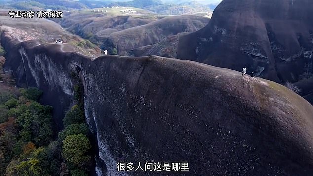 Pictured: China’s nerve-shredding ‘knife-edge’ mountain, which daredevil tourists walk along despite sheer drops – and no safety fences