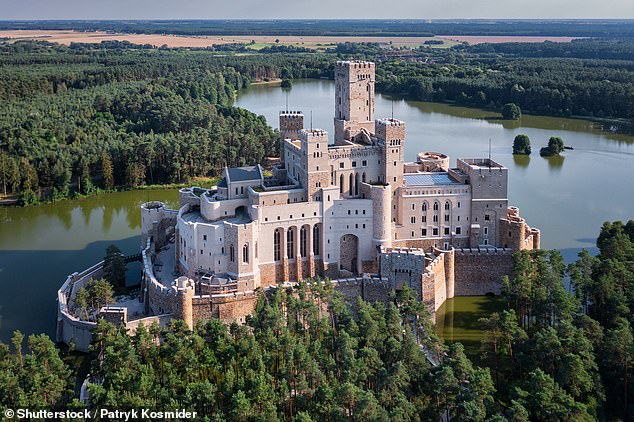 Pictured: The mysterious modern-day fairytale castle in Poland that has been built on an artificial island in a lake. What’s it for? No one seems to know…