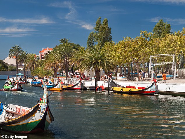 Welcome to the ‘Venice of Portugal’ – where temperatures reach up to 29 degrees, vibrant canals line the streets and pints are just £1.80